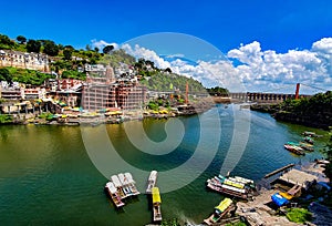 Wide image of Omkareshwar Jyotirlinga shiva temple on Omkar mountain an island in midÃÂ Narmada river, Madhyapradesh, India photo